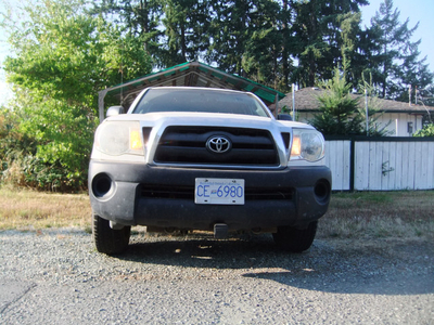 White 2010 Toyota Tacoma 4 cyclinder 2 WD with canopy
