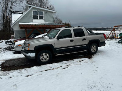 2004 Chevrolet Avalanche with 7 foot Arctic Plow