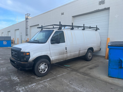 2010 e-series full size van with roof rack and shelves
