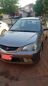 2005 Acura EL. Drivable but needs replacement muffler.