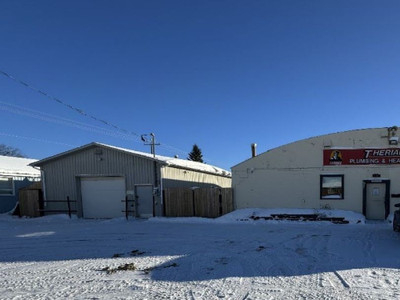 Commercial corner property with 2 buildings and lots of parking