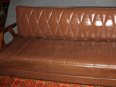 Leather couch/futon with storage space
