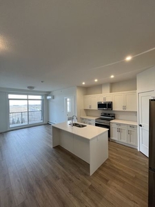 Top floor 2 bed 2 bath brand new condo unit with a view. | 2406 - 200 Seton Circle Southeast, Calgary