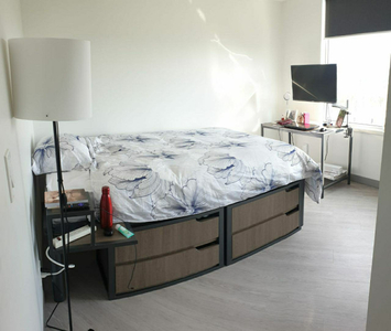 A furnished room in a two bedroom suite