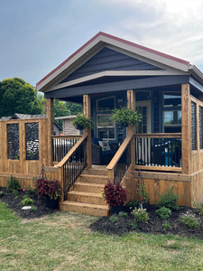 Cedar log park model home with large addition