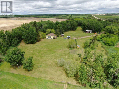 14.95 acres w/house & with good well!