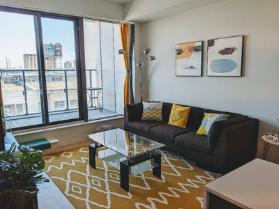 Fully furnished 2 bedroom + den downtown condo