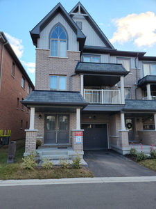 Welcome to this beautiful, open concept end unit townhome.
