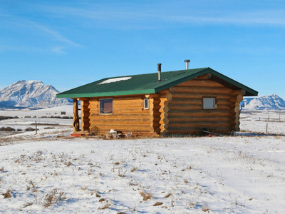Off grid acreage with Log Cabin