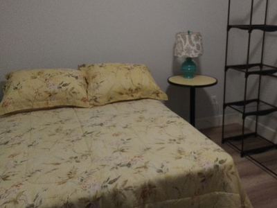 Furnished bedroom and off-street parking